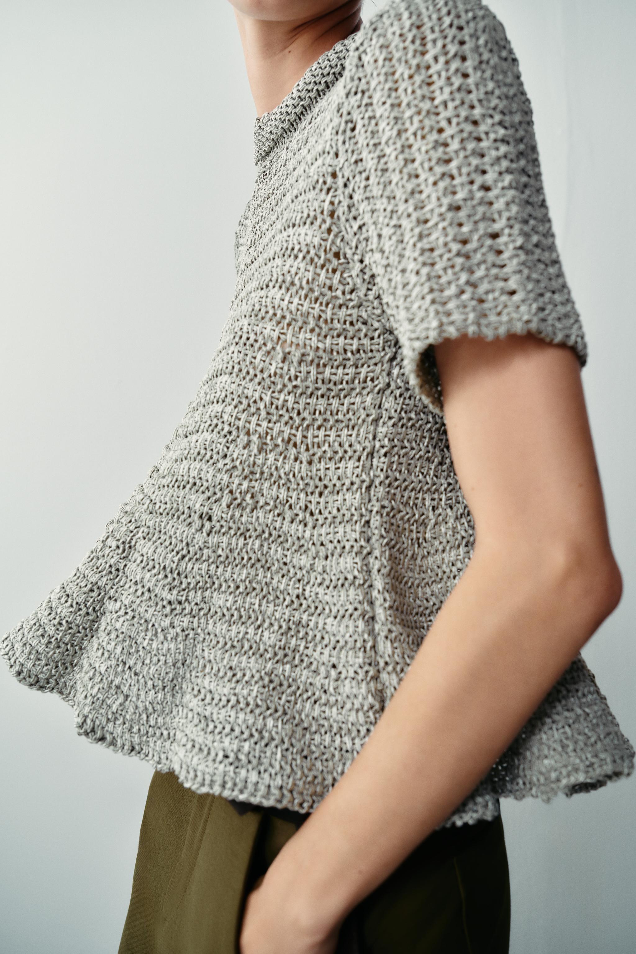 OPEN-KNIT PEPLUM TOP
